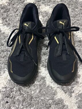 Puma Black Sneakers with Gold Detailing